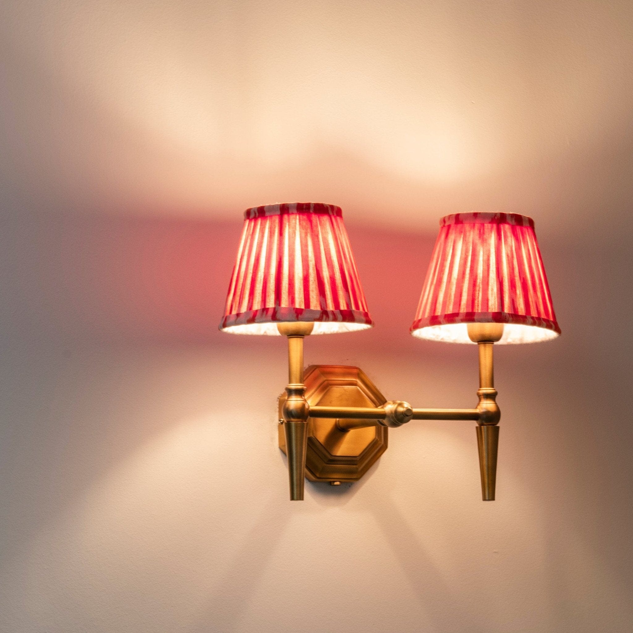 Double Brass Wall Light Orange Pleated Shade Oriana B